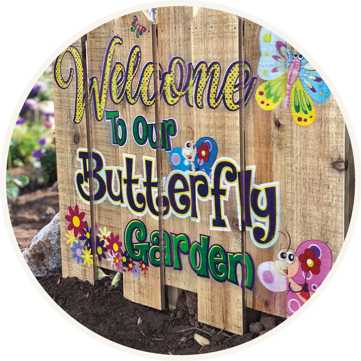 A small wooden fence painted to say 