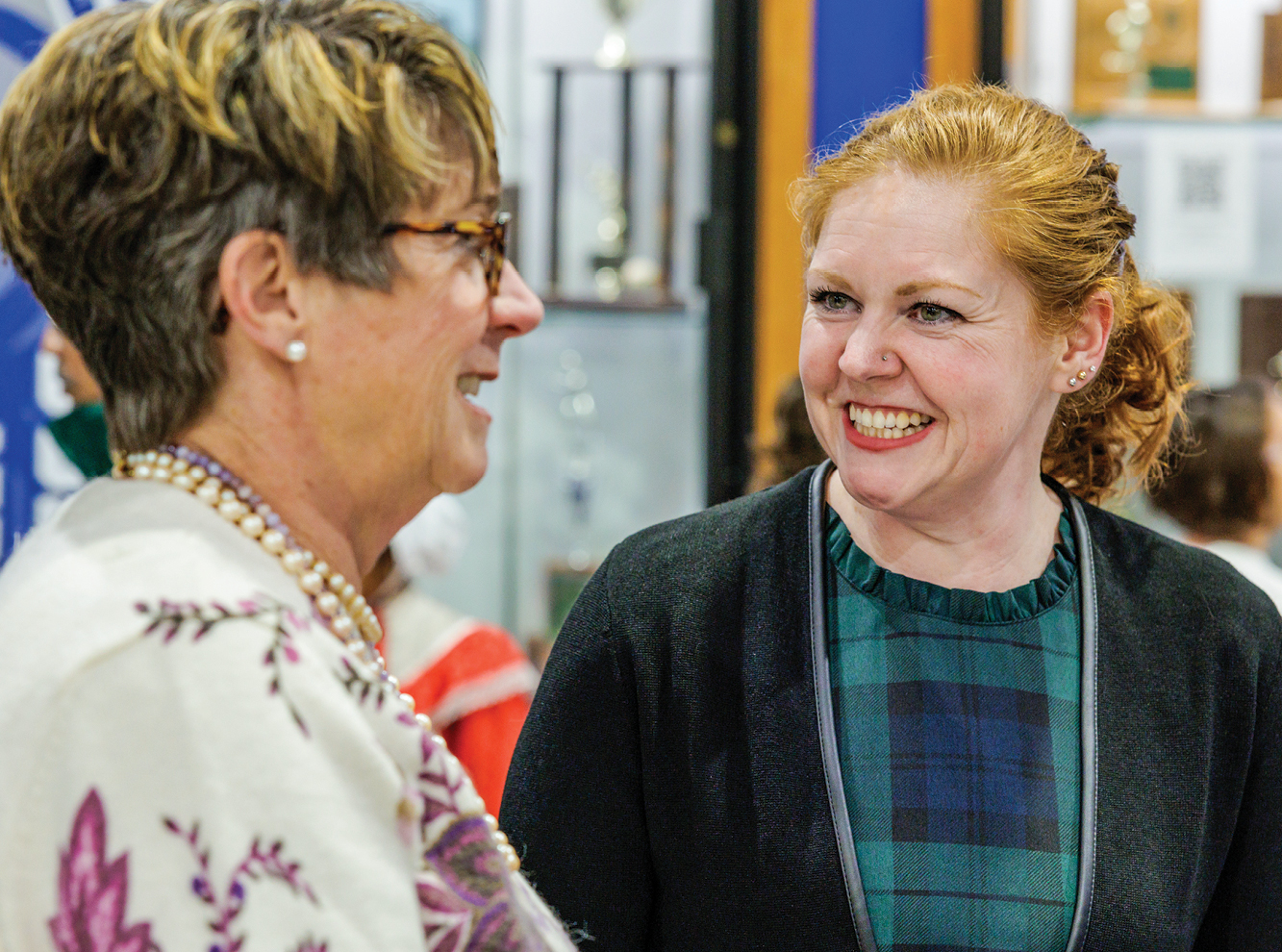Two white women talking and smiling