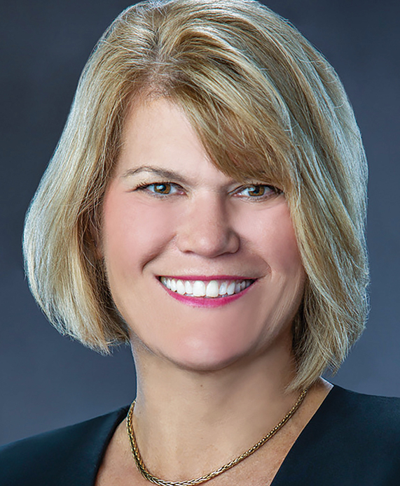 A white woman smiling headshot