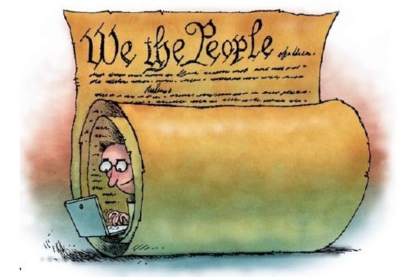 Cartoon of a man wrapped in the constitution with his laptop