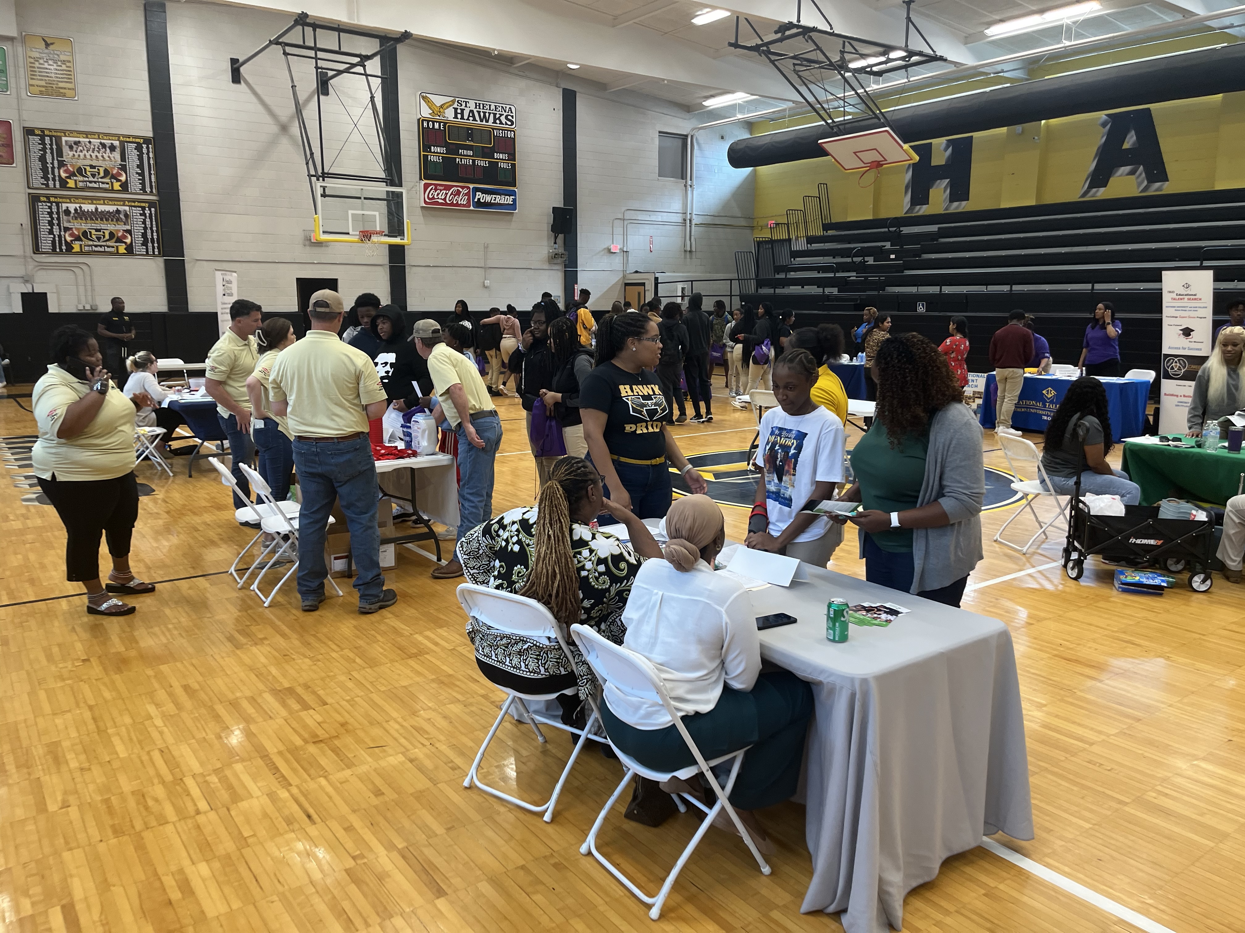 Students and business leaders in a gymnasium at an Intern Expo at St Helena Parish in Louisiana