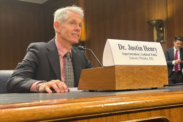 Justing Henry testifying during spotlight forum