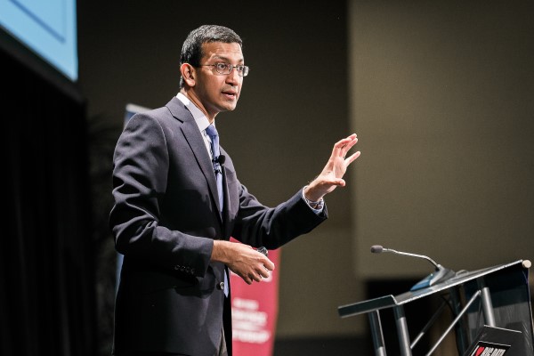 Raj Chetty speaks on stage