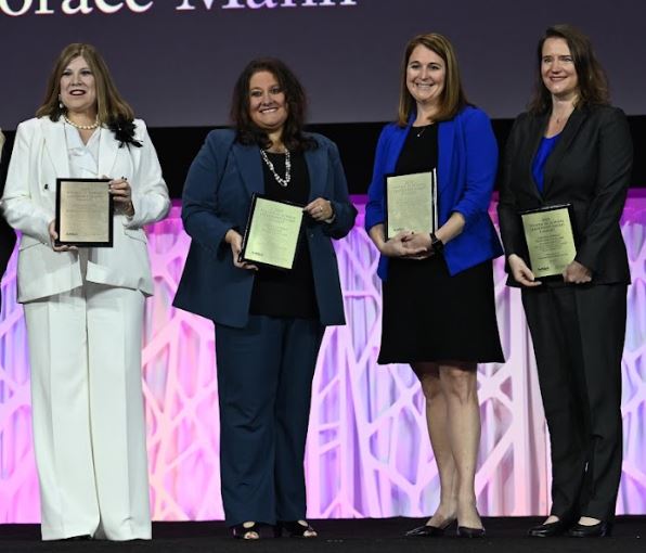Women in School Leadership nominees on stage