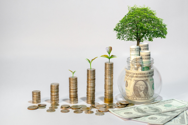 Graphic of saving up quarters turning into tree with money