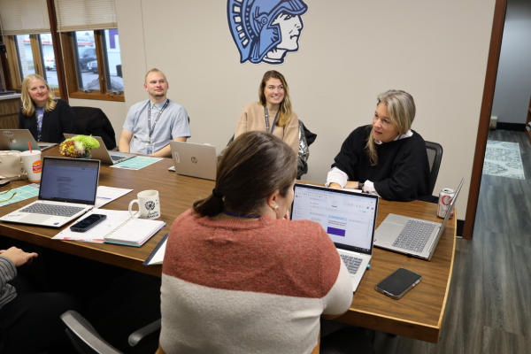 Amy L. Starzecki meets with district team.