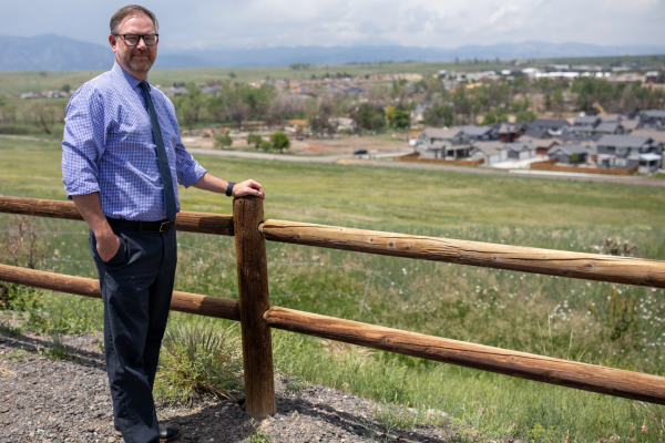 Rob Anderson overlooks community where wildfire passed