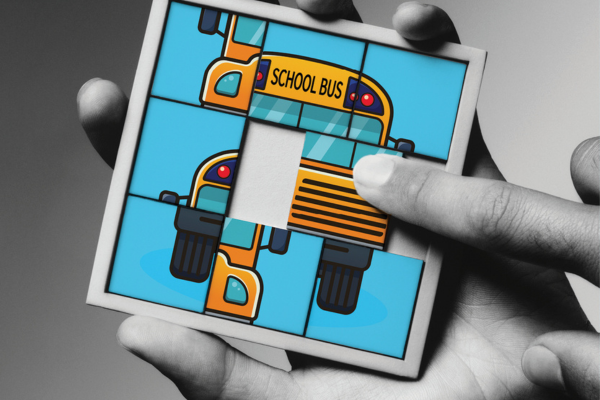 Puzzle with different pieces of a school bus illustration
