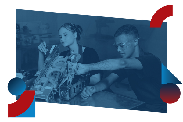 Students working on machine