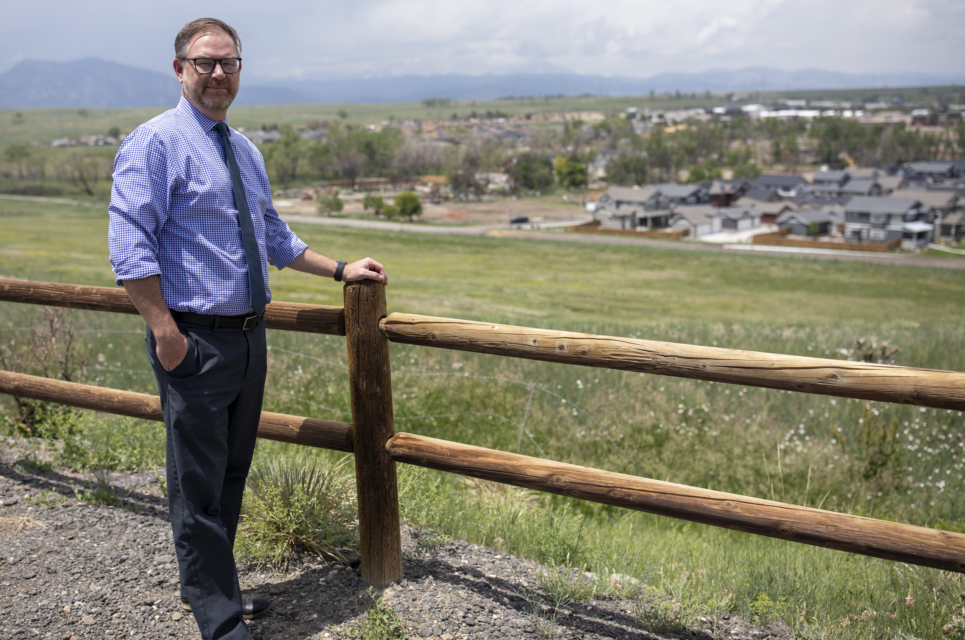 Rob Anderson overlooks a neighborhood where the Marshall Fire passed