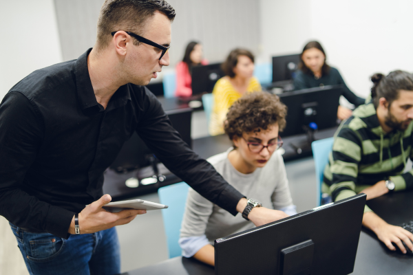 Teacher and students in computer lab