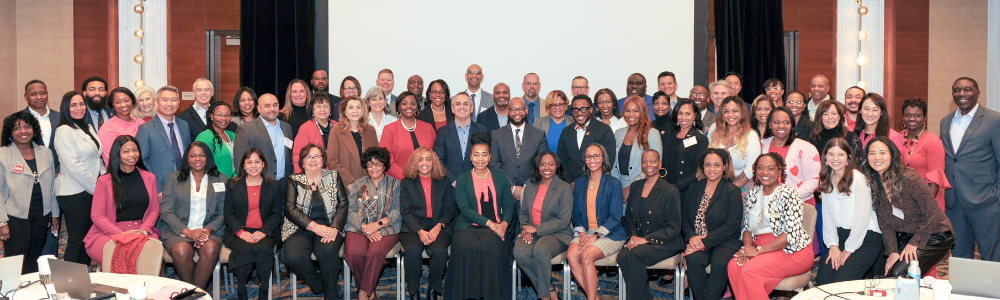 Large group of leaders from the Urban Superintendents Academy smiling