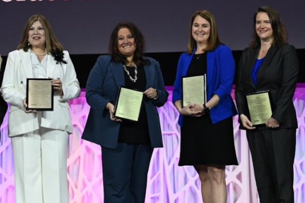 Women in School Leadership nominees on stage